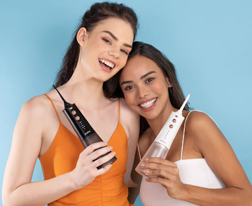 image of two models showcasing perfora’s water flosser for healthy teeth