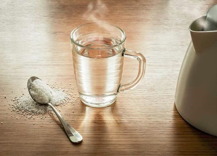 How does salt water benefit oral health?